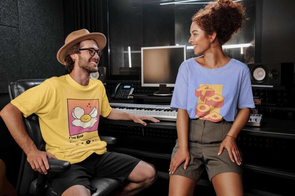 T Shirt Mockup Of Two Singers Hanging At A Recording Studio