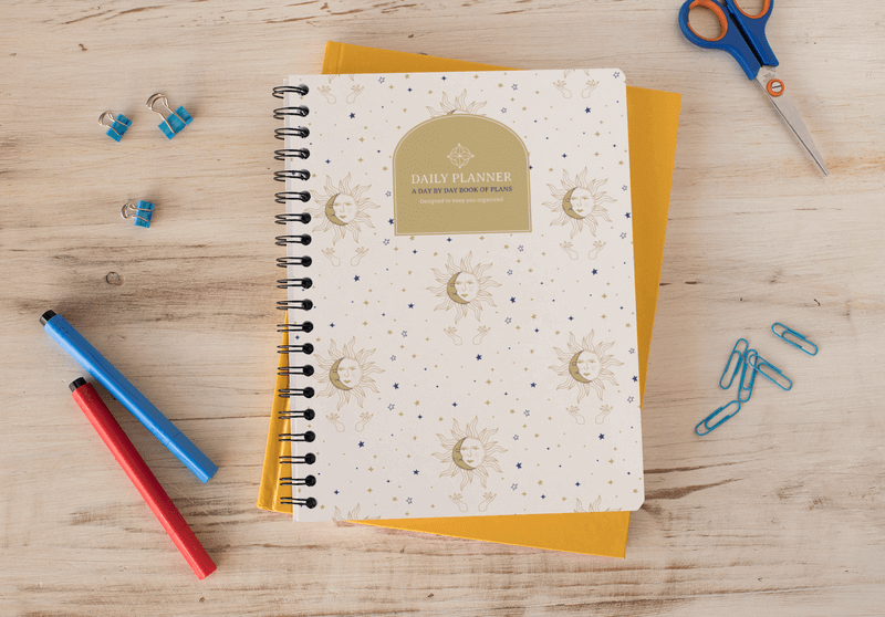 Mockup Of A Spiral Notebook On A Wooden Surface With Stationery Supplies