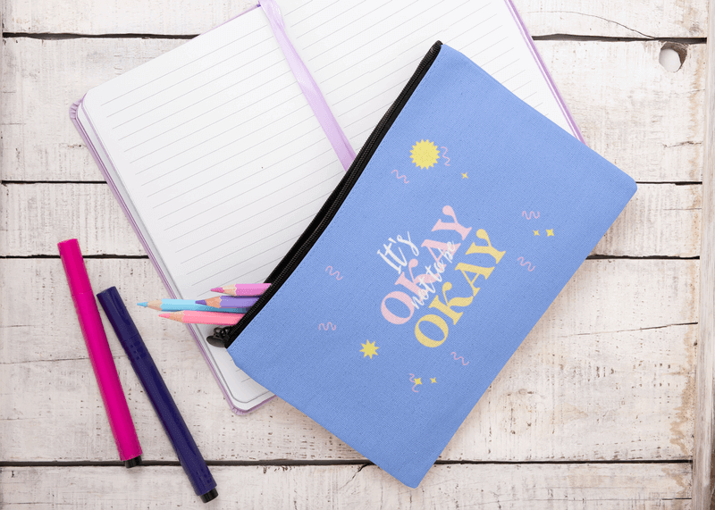 Pouch Mockup Featuring A Journal And A White Wooden Table