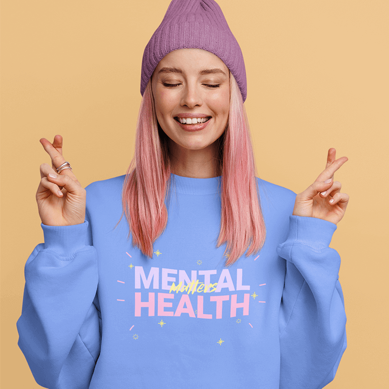 Sweatshirt Mockup Of A Woman With Her Fingers Crossed In A Studio