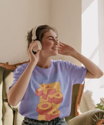 Mockup Of A Woman Wearing A Loose T Shirt And Listening To Music