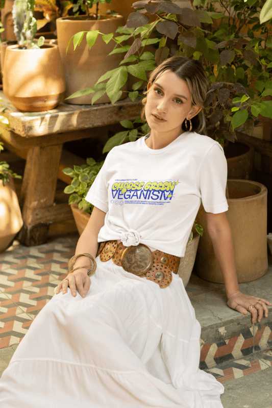 Bella Canvas T Shirt Mockup Of A Woman Posing By Plant Pots In A Boho Style Outfit