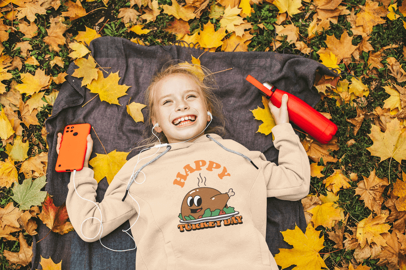 Hoodie Mockup Featuring A Girl Laughing And Some Dry Leaves