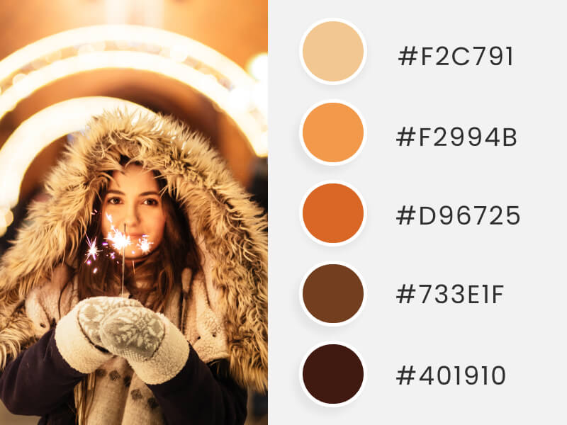 Winter Color Palettes - a young gilr wearing winter clothes while holding a flare