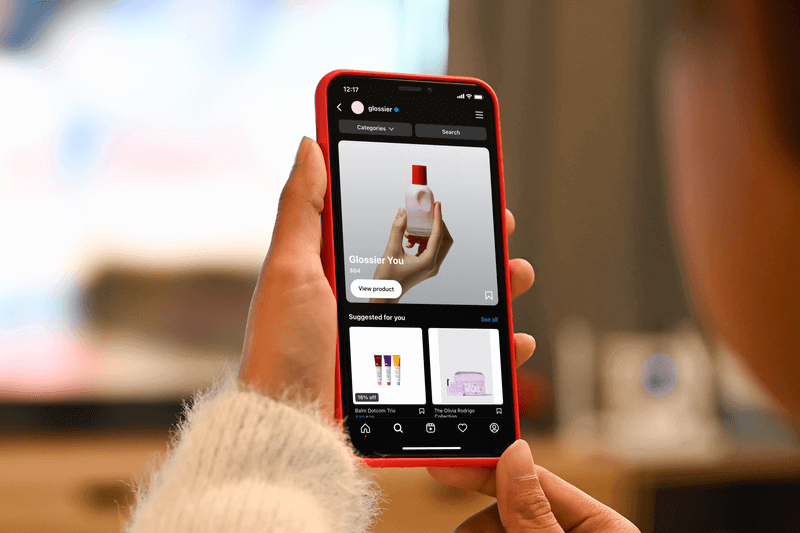 Over The Shoulder Mockup Of A Woman Using Her Iphone 11 Pro To Shop On Instagram