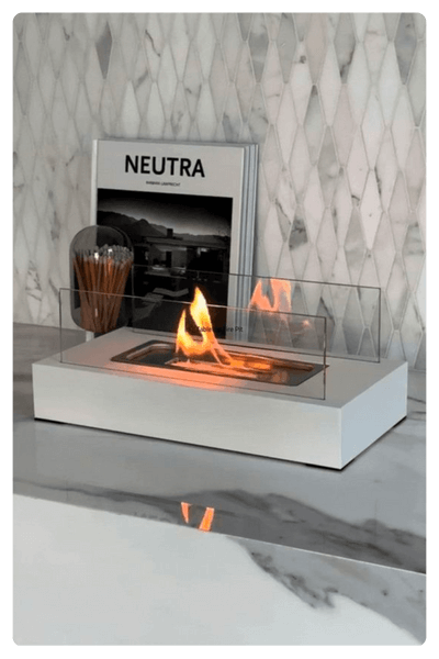 A Mini Fire Table In A White Color In An Indoor Space As One Of The Best Dropshipping Products For 2024