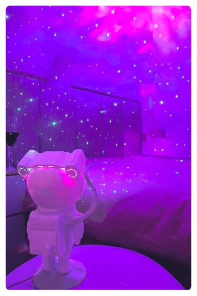 An Astronaut Galaxy Projector Illuminating A Room In Pink And Purple Shades With Some Glitter On It, Representing One Of The Best Dropshipping Products For 2024