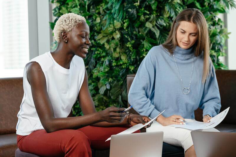 Two Women Working Together And Looking At A Social Media Report Picture By Pexels