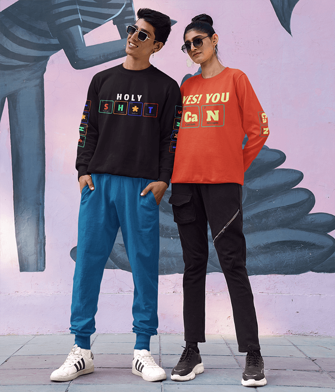 Sweatshirt Mockup Of A Smiling Couple Posing Against A Painted Mural