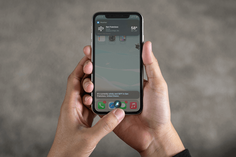 Mockup Of A Man Using An Iphone 11 In Vertical Position