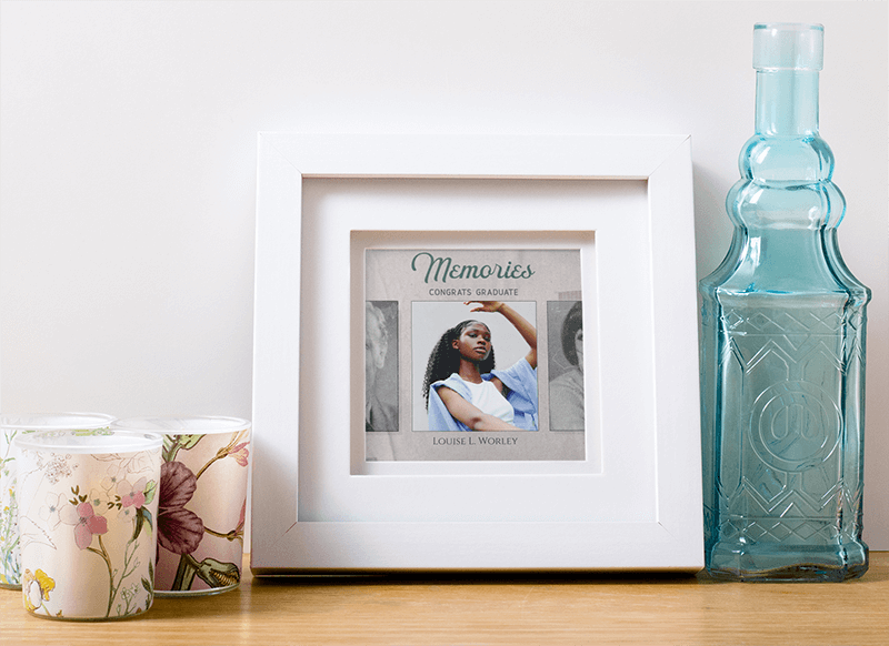 Photo Frame Mockup Featuring Some Candles And A Glass Bottle