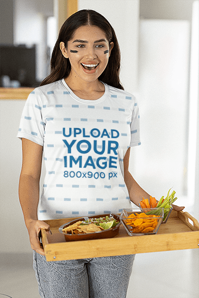 Jersey Mockup Of A Woman Holding A Tray With Snacks At A Football Watch Party