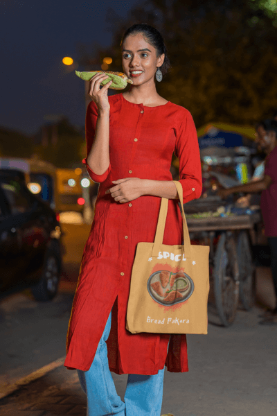 Tote Bag Mockup Of A Woman Eating Street Food At Night M30334