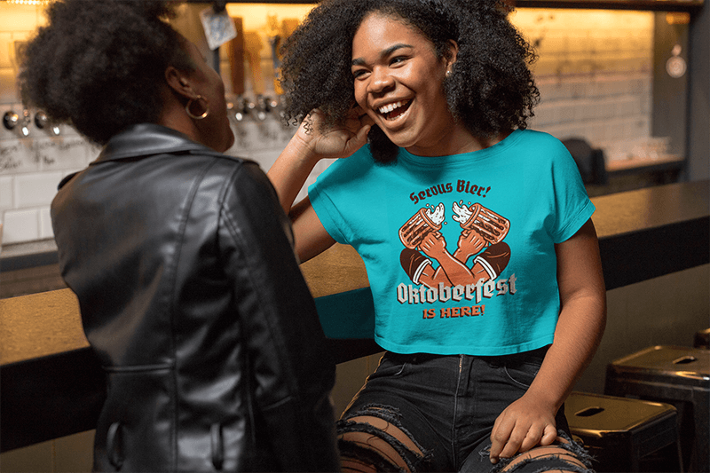 Crop Top Mockup Featuring A Joyful Woman Talking With A Friend At A Bar