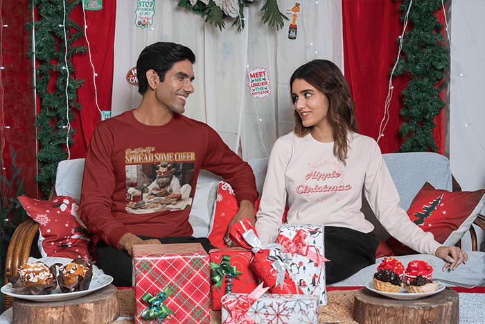 Sweatshirt Mockup Featuring A Couple In A Christmas Decorated Living Room