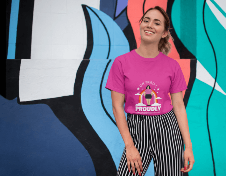 Tee Mockup Of A Smiling Girl In Front Of A Wall With Colorful Illustrations