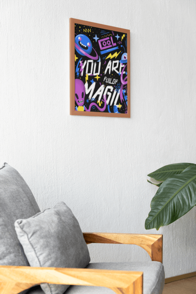 Mockup Of An Art Print Hanging On A Wall Featuring A Couch