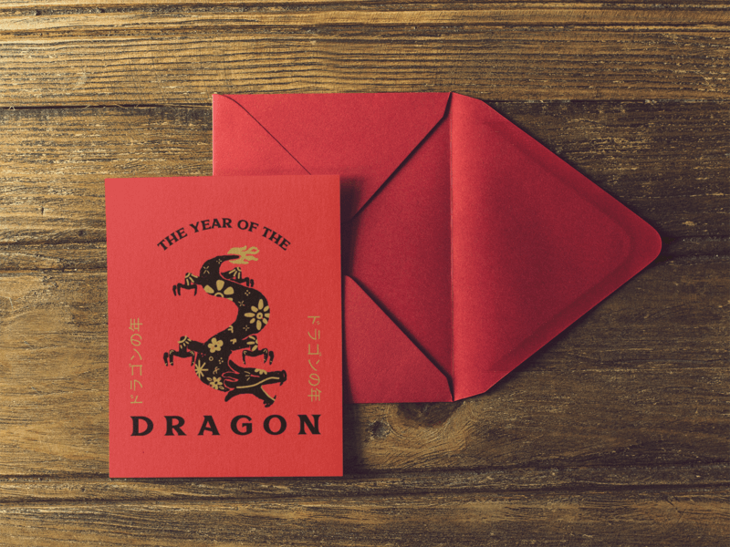 Invitation Template On A Red Envelope Over A Wooden Table