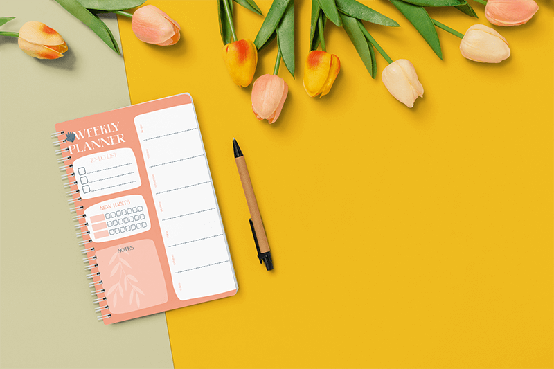 Mockup Of A Notebook Featuring Tulips And A Pen
