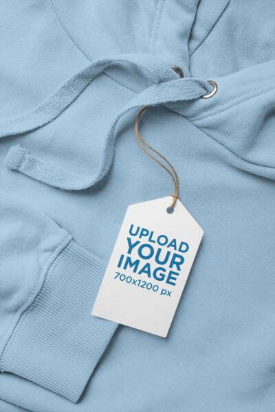 Mockup Of A Clothing Tag Lying On A Hoodie