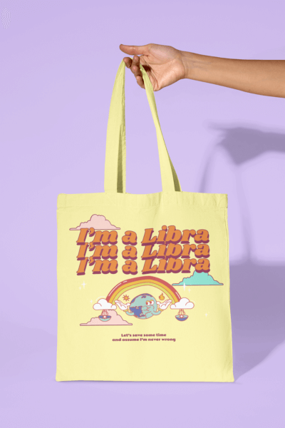 Mockup Of A Person Holding A Sublimated Tote Bag Against A Pastel Background