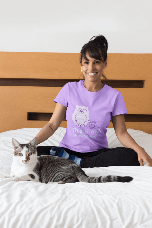 Portrait Of A Happy Cat Owner Wearing A T Shirt Mockup On Bed