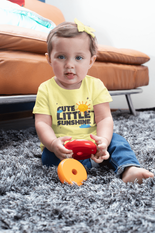 Sublimated T Shirt Mockup Of A Baby Girl Playing With Toys