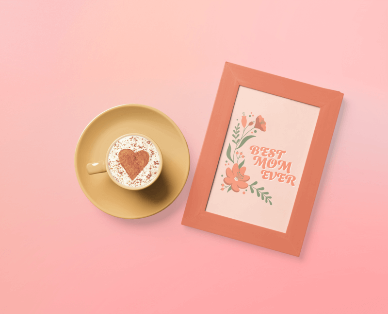 Mockup Of An Art Print Placed Next To A Cup Of Coffee With A Heart