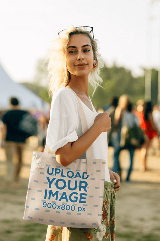 Mockup Of An AI Generated Woman Carrying A Tote Bag At A Music Festival