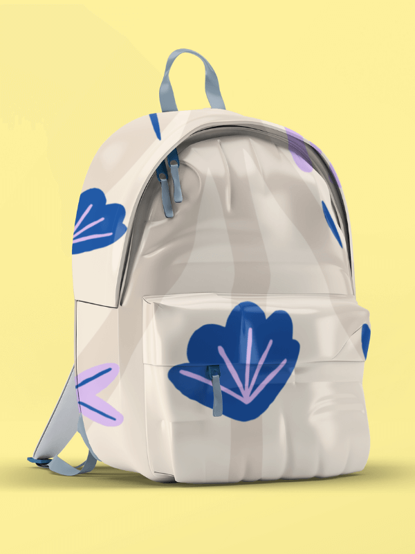 A Backpack With A Shell Beachy Design Placed On A Solid Surface