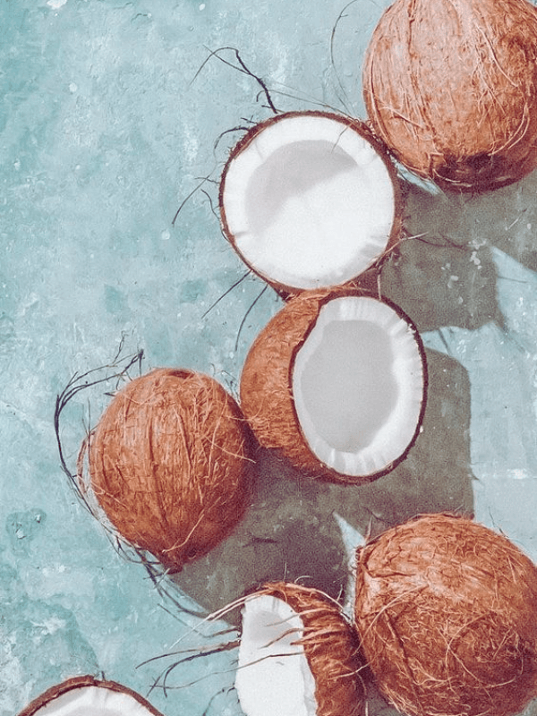 A Beautiful Set Of Fresh Coconuts Floating In The Water