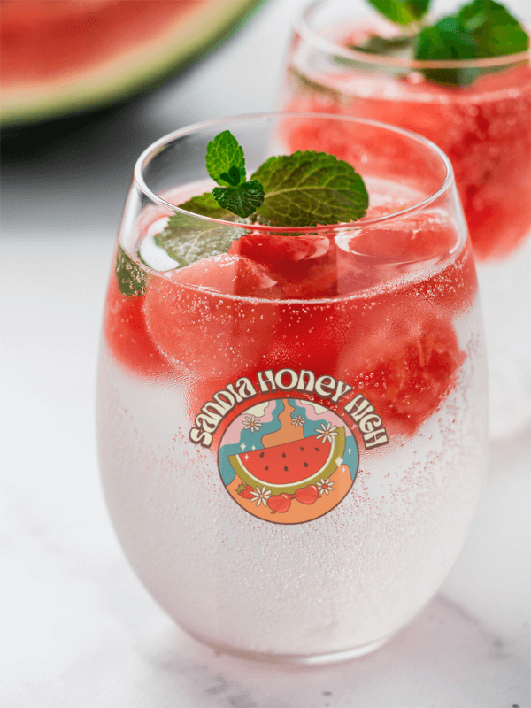 A Stemless Wine Glass With A Summery Watermelon Theme Featuring A Watermelon Infused Drink