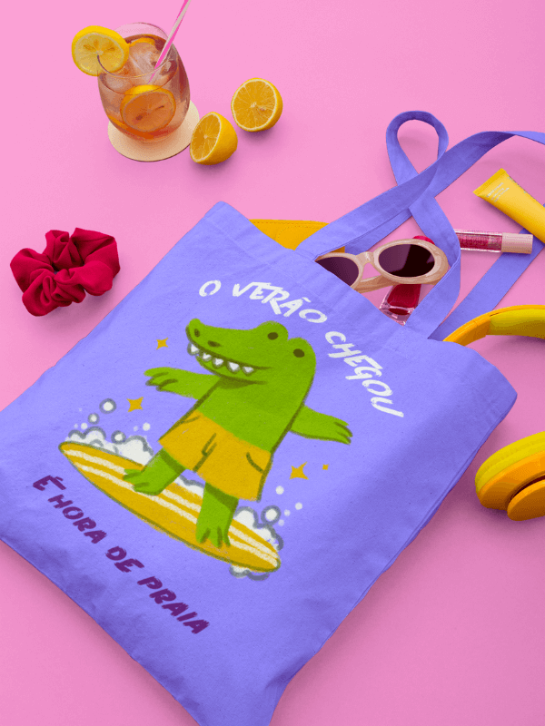 A Summer Tote Bag Stuffed With Girly Garments Featuring A Crocodile Surfing