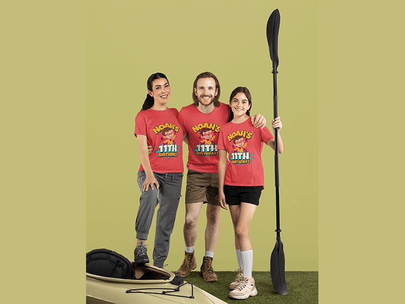 Bella Canvas T Shirt Mockup Of A Girl And Her Parents Posing With A Kayak