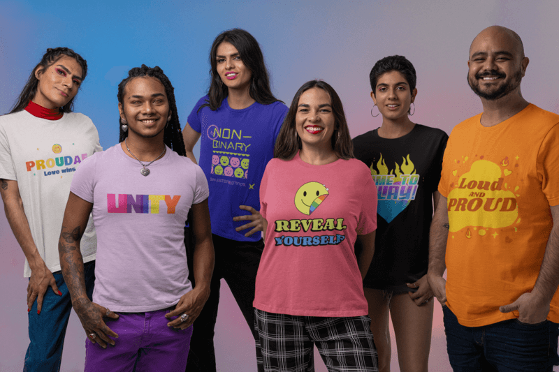 Bella Canvas Tee Mockup Featuring A Group Of Friends Posing At A Studio For A Pride Marketing Campaign