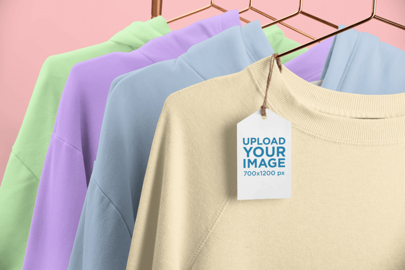 Brand Tag Mockup Featuring A Rack Of Crewneck Sweatshirts