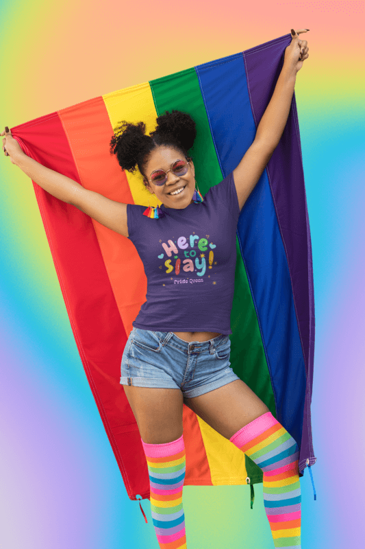 Colorful T Shirt Mockup Of A Woman Proudly Holding A Rainbow Flag As Part Of Pride Merch