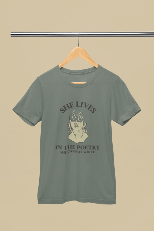 Mockup Of A Book Themed Bella Canvas Round Neck Tee Placed On A Wooden Hanger