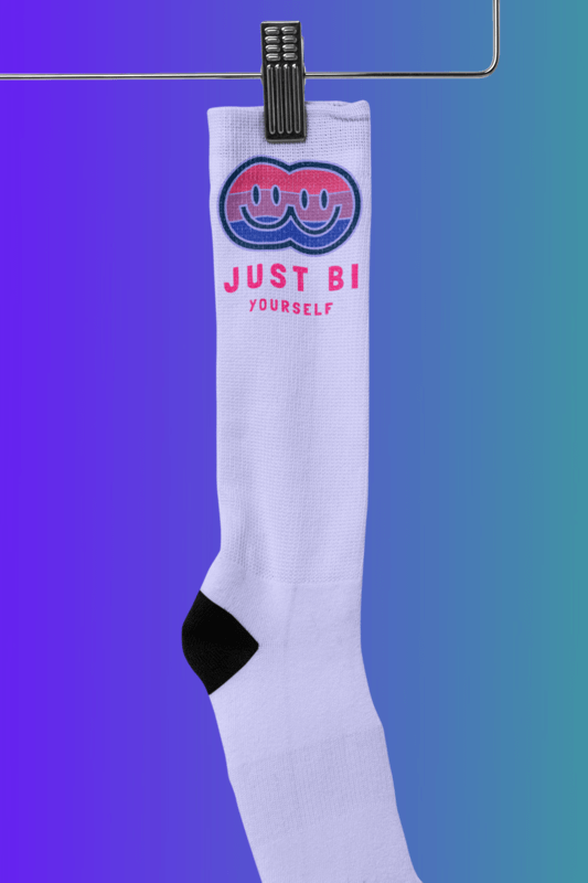 Mockup Of A Sublimated Sock Hanging Against A Customizable Background