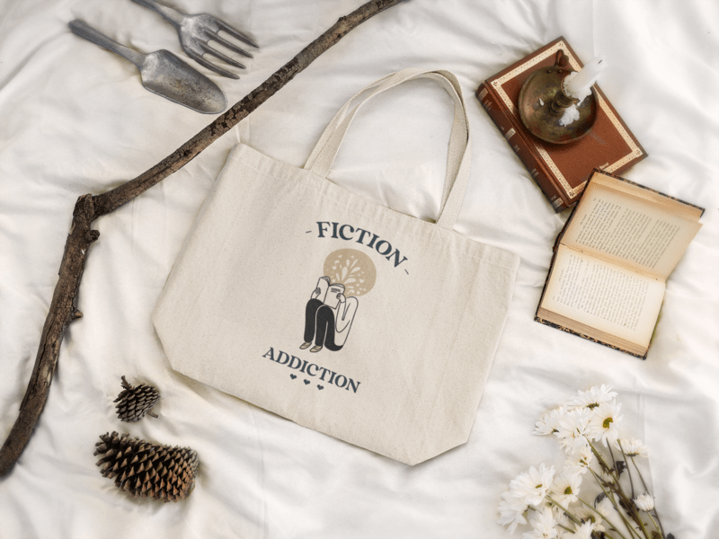Mockup Of A Tote Bag Lying In A Cottagecore Styled Setting As Inspiration For Gifts For Book Lovers
