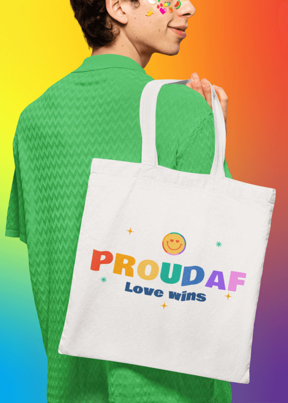 Sublimated Tote Bag Mockup Of A Smiling Man With Skin Stickers Showcasing Pride Merch