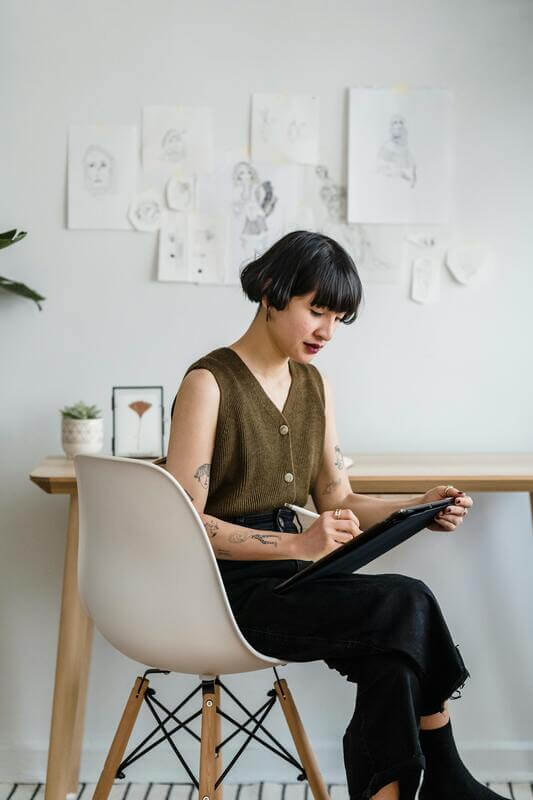 Photo Of A Designer Sketching By Pexels
