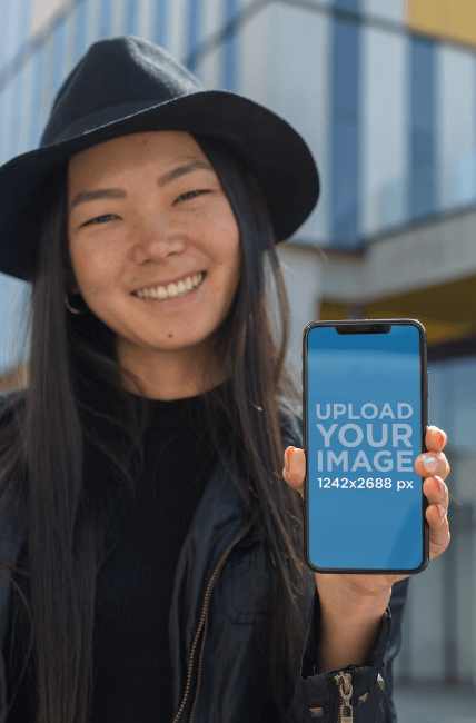 Iphone Xs Max Mockup Featuring A Trendy Girl Showing Off Her Screen