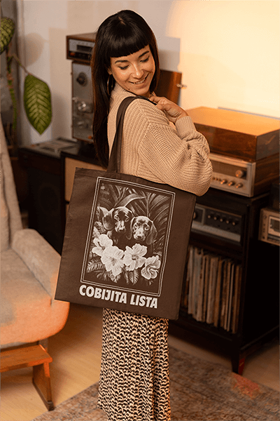Mockup Featuring A Woman Carrying A Sublimated Tote Bag Over Her Shoulder At Home