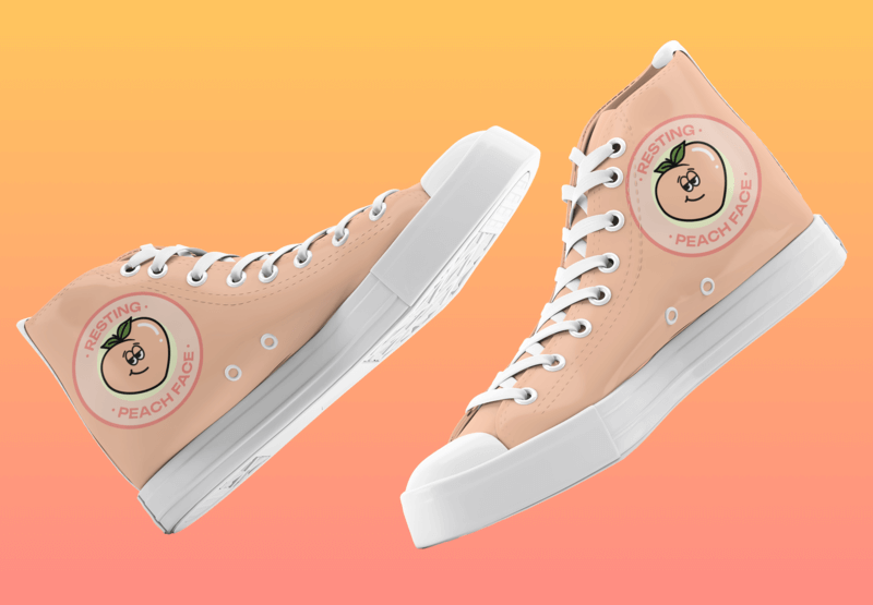 Mockup Of A Pair Of Sublimated Canvas Sneakers With A Cartoon Peach Design