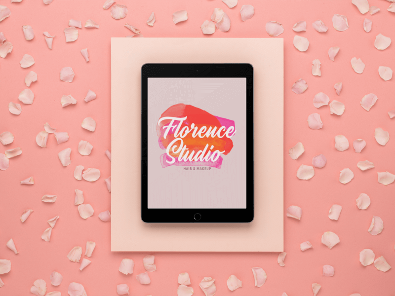 Space Gray Ipad Mockup In A Salmon Pink Studio Set Featuring A Beauty Logo