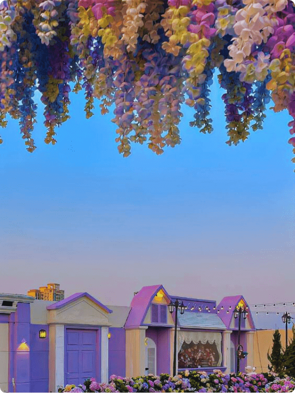 A Calm Evening With A Blue Sky, Green And Purple Leaves, And Purple Houses