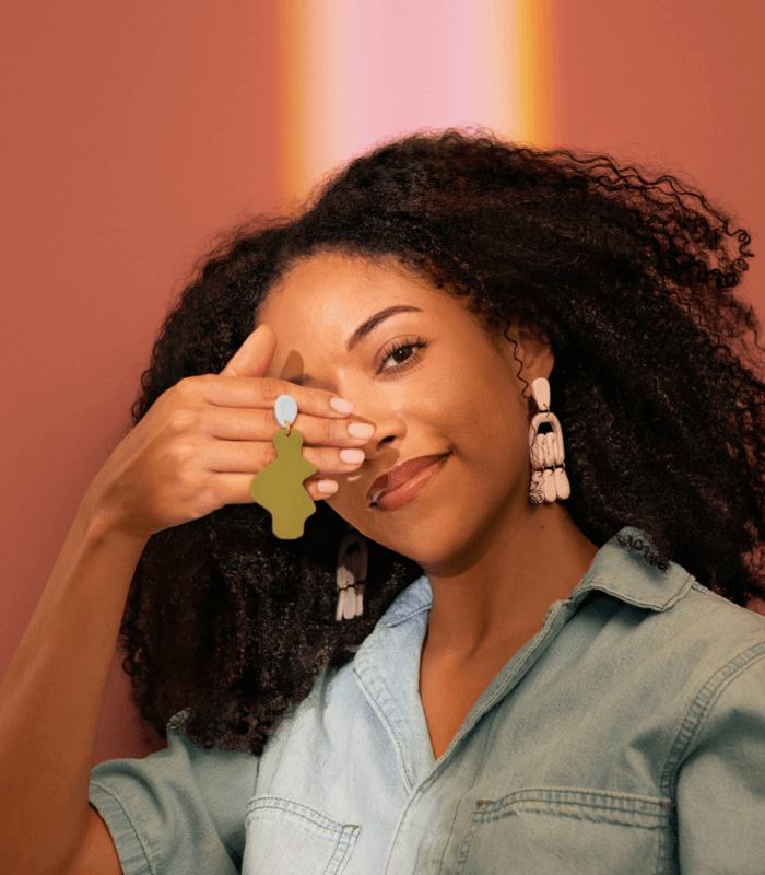 Pachestudio Model Showcasing A Pair Of Handmade Earrings