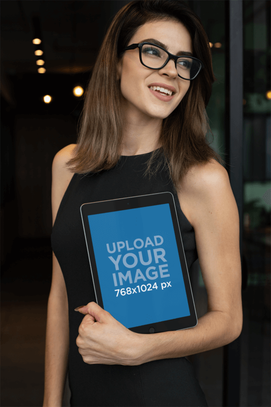 Mockup Of A Businesswoman Holding An iPad