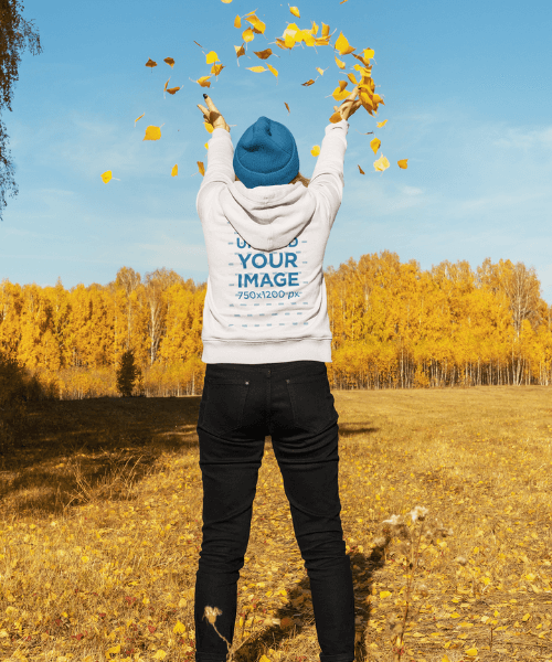 Back View Hoodie Mockup Of A Woman Playing With A Bunch Of Autumn Leaves